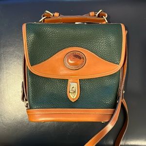 Dooney & Bourke great cross body. Scratched latch closure. Inner tag was cut.